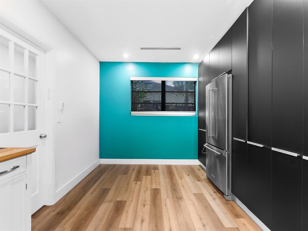 4411 Thomas Street Hollywood, FL 33021 - Photo 9 of 21 a view of a fridge with wooden floor