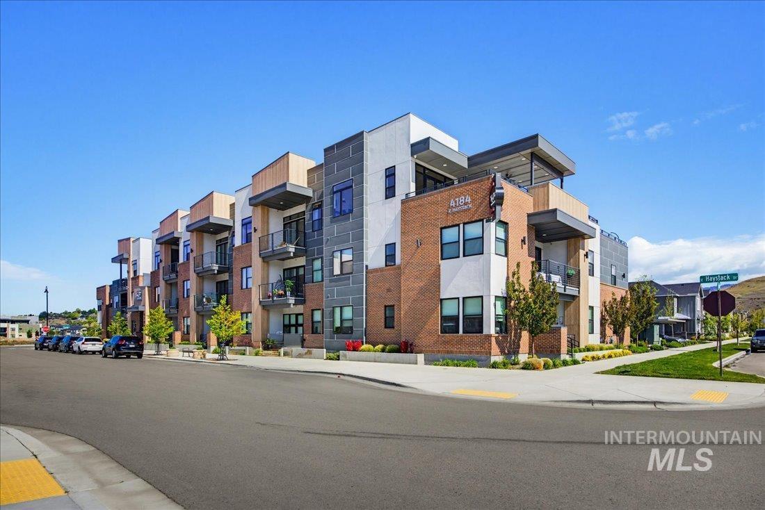 4184 East Haystack Street, Unit 103 Boise, ID 83716 - Photo 22 of 27 Contemporary multi-story building featuring brick and paneling exterior finishes