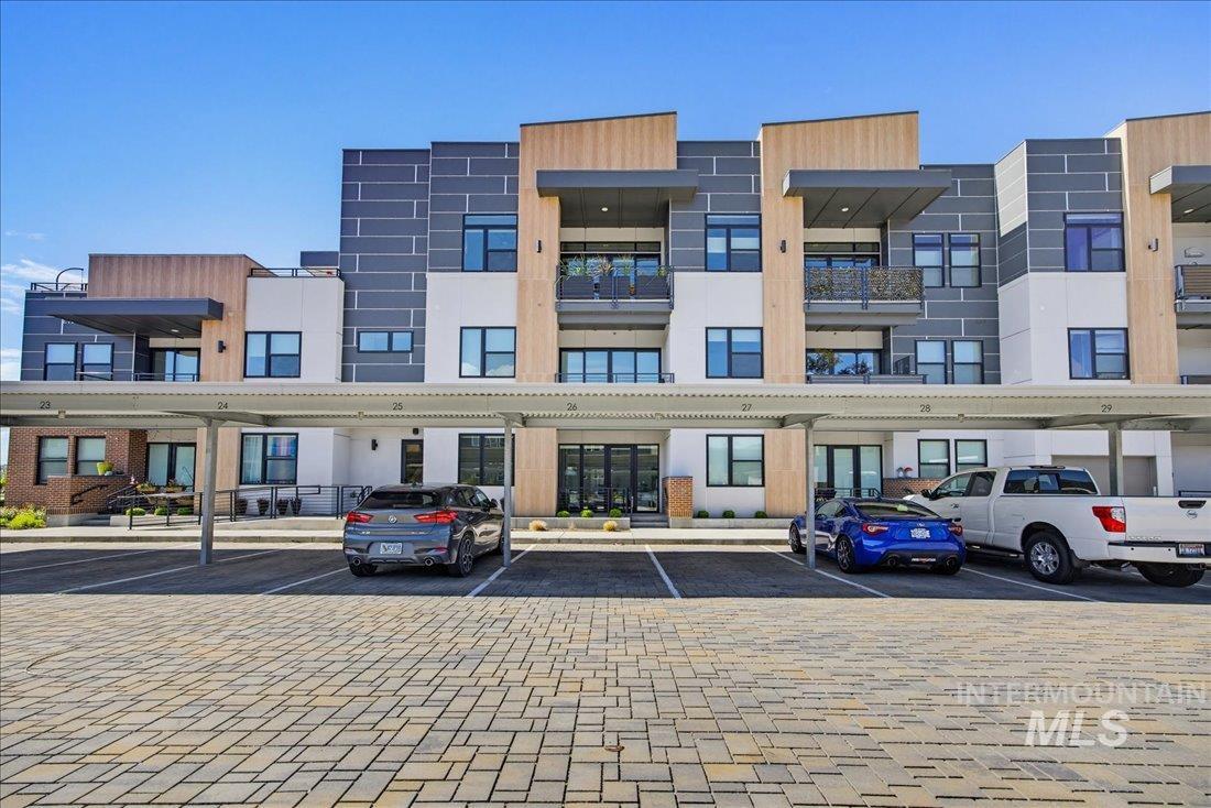4184 East Haystack Street, Unit 103 Boise, ID 83716 - Photo 25 of 27 Contemporary multi-story building featuring varied facade materials including wood-finish panels and textured gray siding