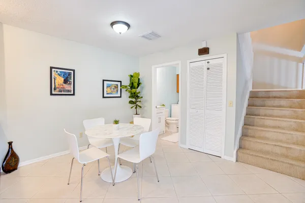 a view of a livingroom with furniture and staircase