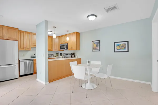 a kitchen with a white cabinets and white appliances