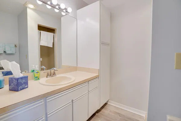 a bathroom with a sink a vanity and a mirror