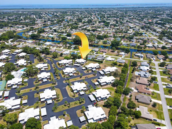 an aerial view of residential houses with outdoor space