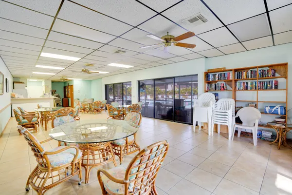 a dining room with furniture and a book shelf
