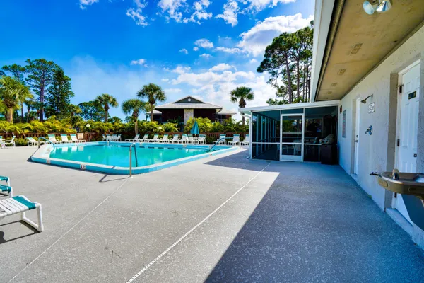 a view of a house with a basketball court