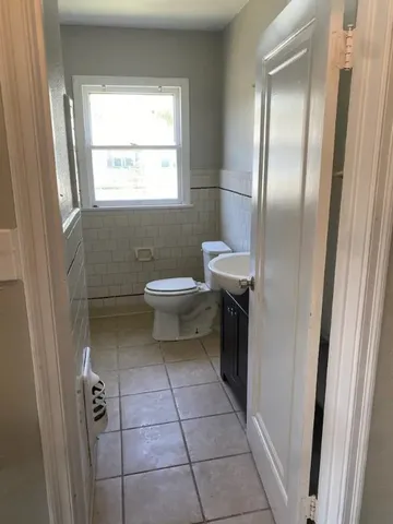 a bedroom with a bed and a cabinets