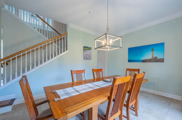 a kitchen with granite countertop white cabinets and sink
