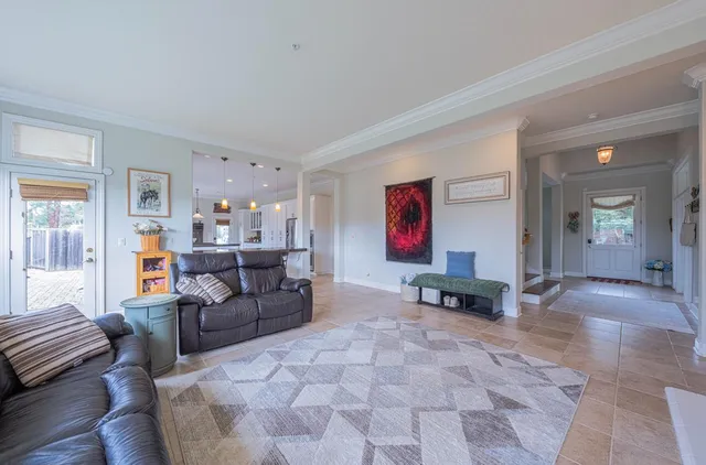 a bedroom with a bed and flat screen tv