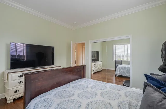 a view of staircase with railing and white walls
