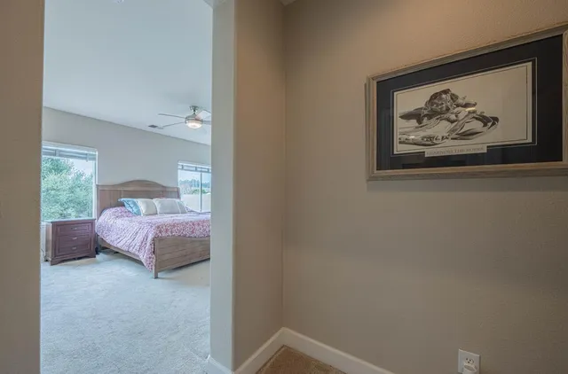 a bath tub sitting in a bathroom next to a window