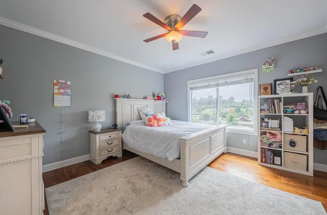 a bedroom with furniture and a window