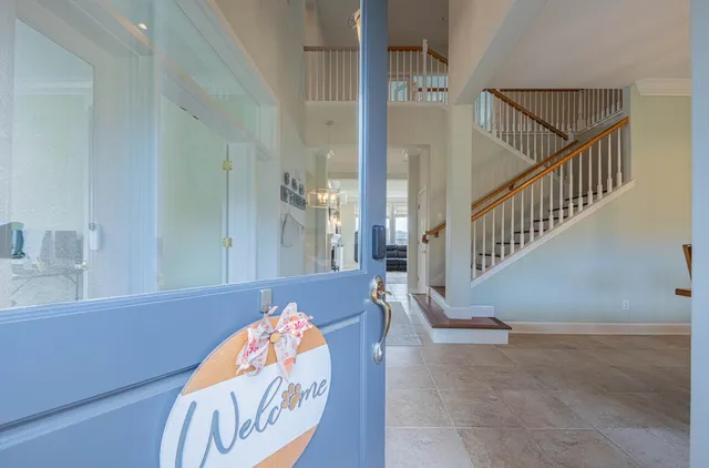 a view of a dining room with furniture wooden floor and chandelier