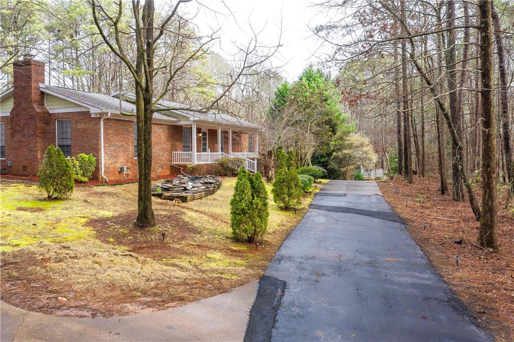 a view of a backyard with pathway