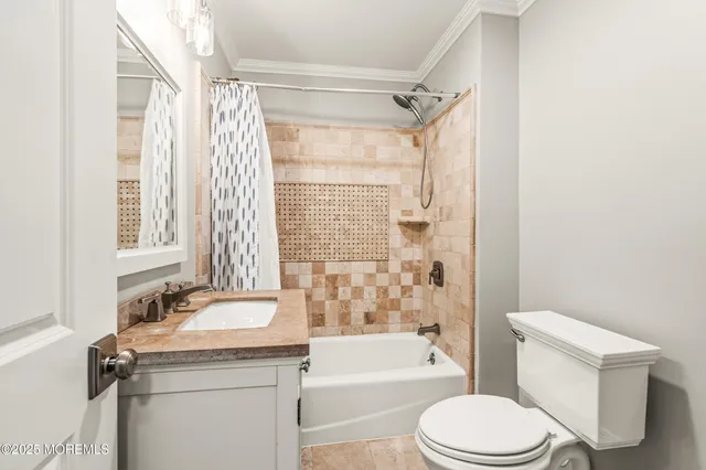 a bathroom with a granite countertop toilet a sink and a bathtub