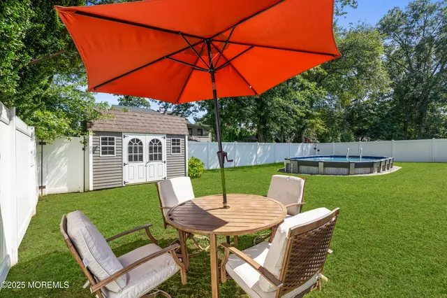 a view of yard with patio
