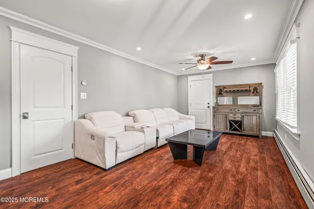 a living room with furniture and large window