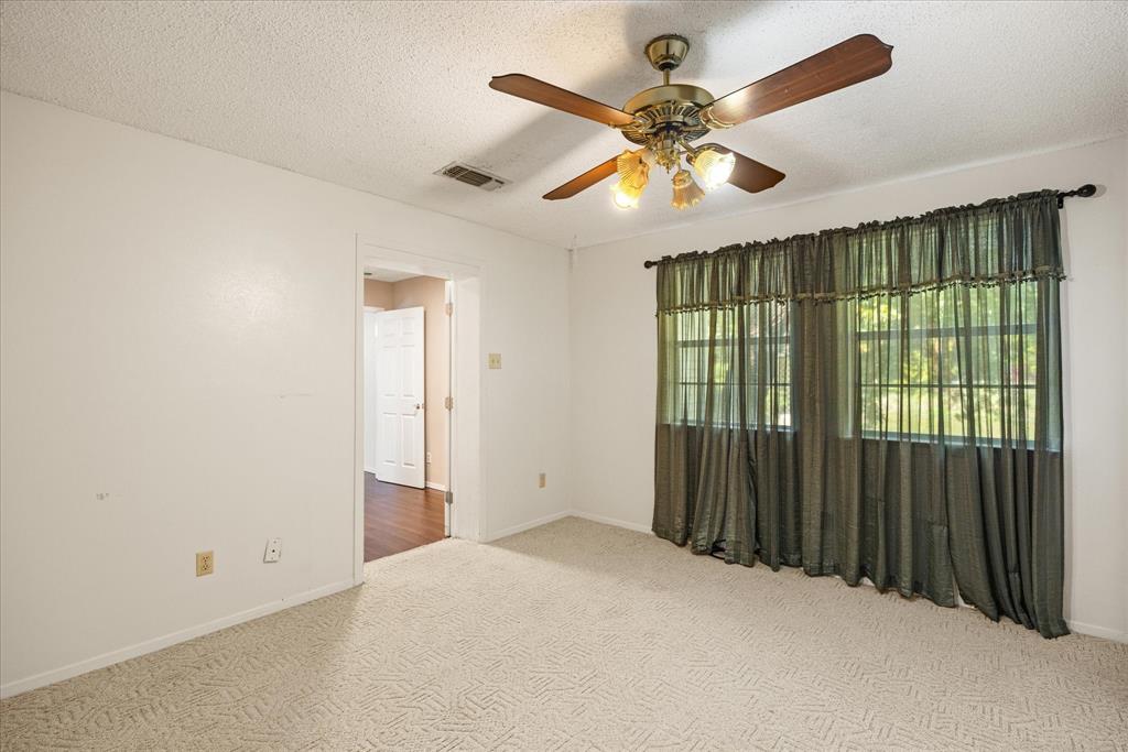 246 Comanche Trail Weatherford, TX 76087 - Photo 12 of 37 a view of an empty room with a window
