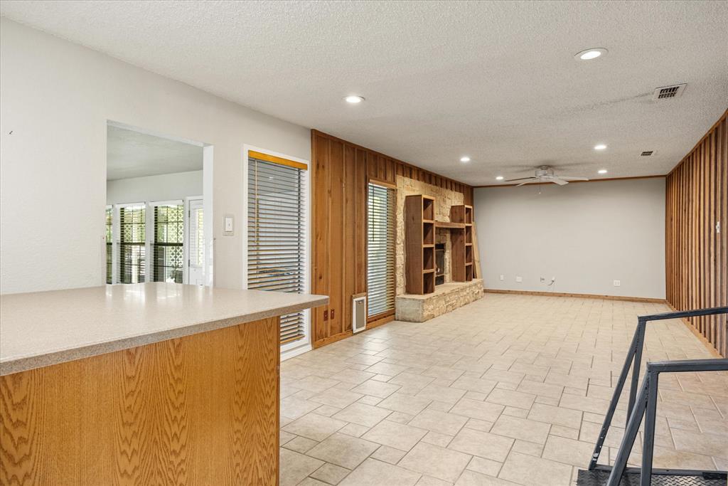246 Comanche Trail Weatherford, TX 76087 - Photo 15 of 37 a view of an empty room with wooden floor and a window