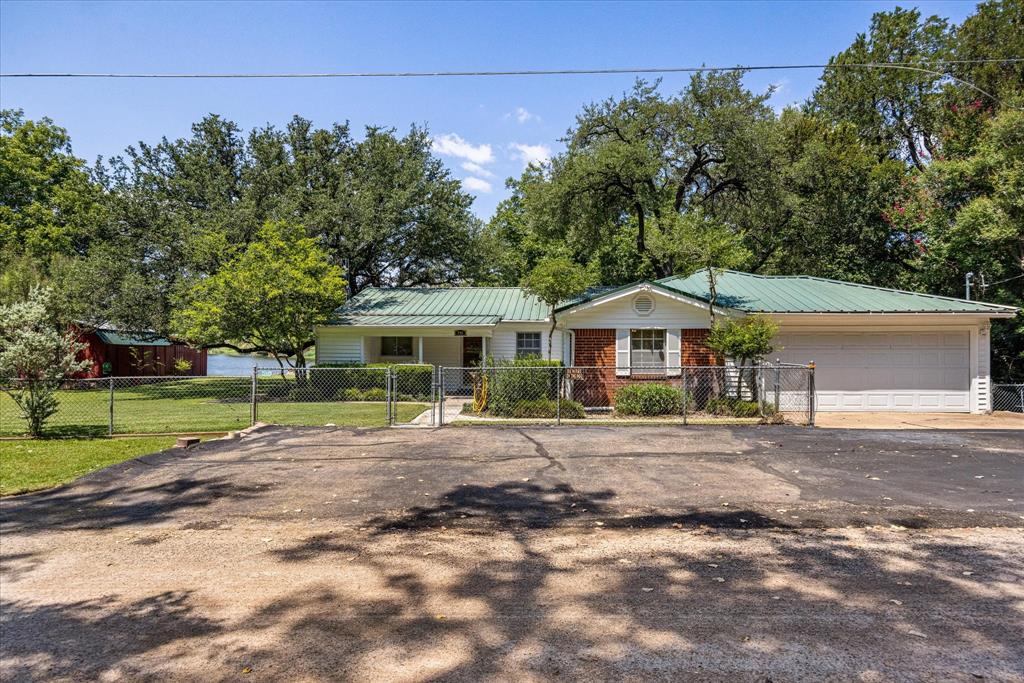 246 Comanche Trail Weatherford, TX 76087 - Photo 21 of 37 a front view of a house with a yard