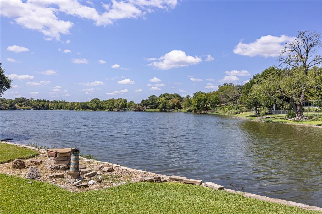 246 Comanche Trail Weatherford, TX 76087 - Photo 27 of 37 a lake view with houses in the back