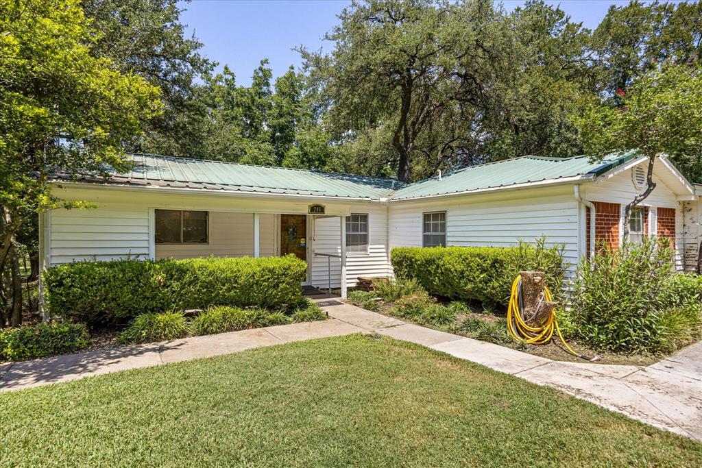 246 Comanche Trail Weatherford, TX 76087 - Photo 4 of 37 a front view of a house with garden