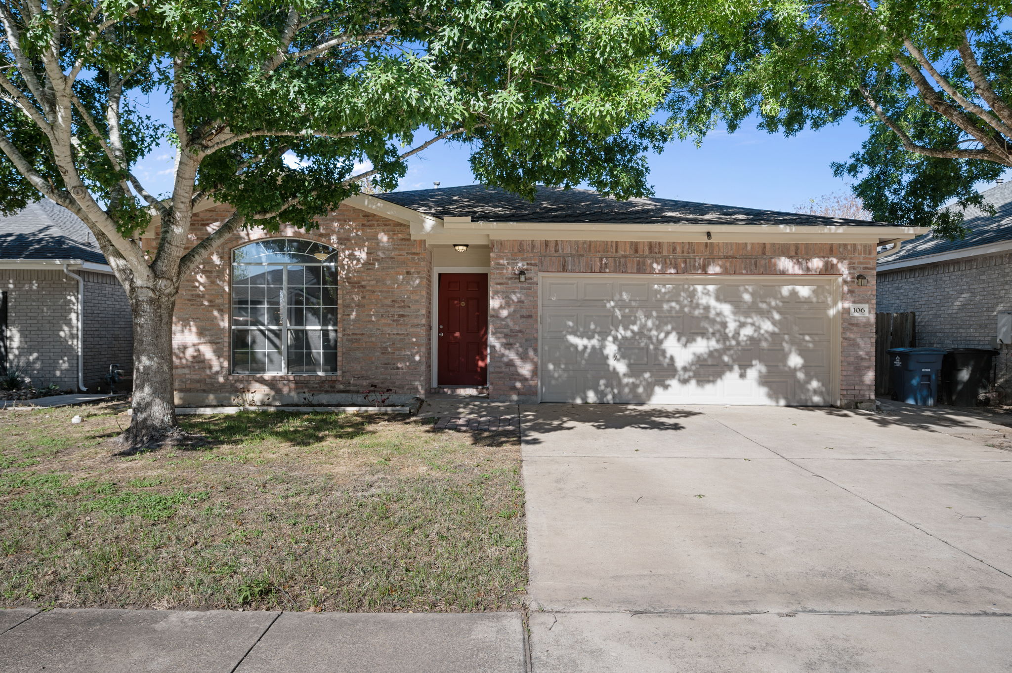 106 Shenandoah Trail Elgin, TX 78621 - Photo 1 of 26 front view of a house with a tree