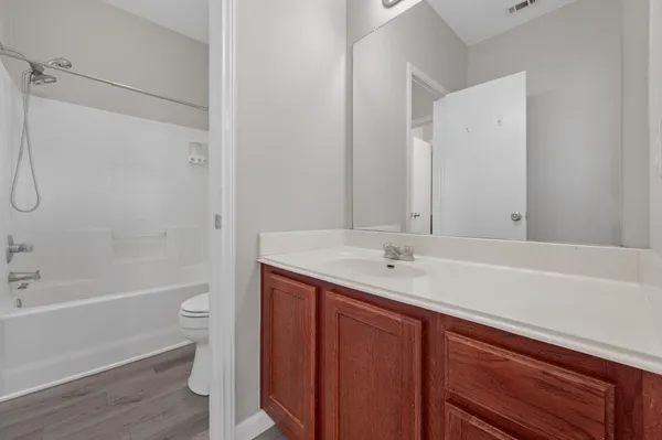 a bathroom with a bathtub and a sink