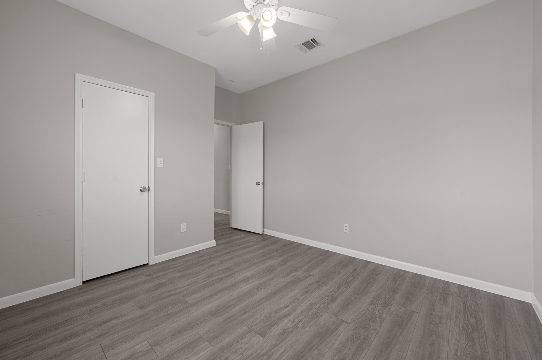 106 Shenandoah Trail Elgin, TX 78621 - Photo 20 of 26 a view of an empty room with wooden floor