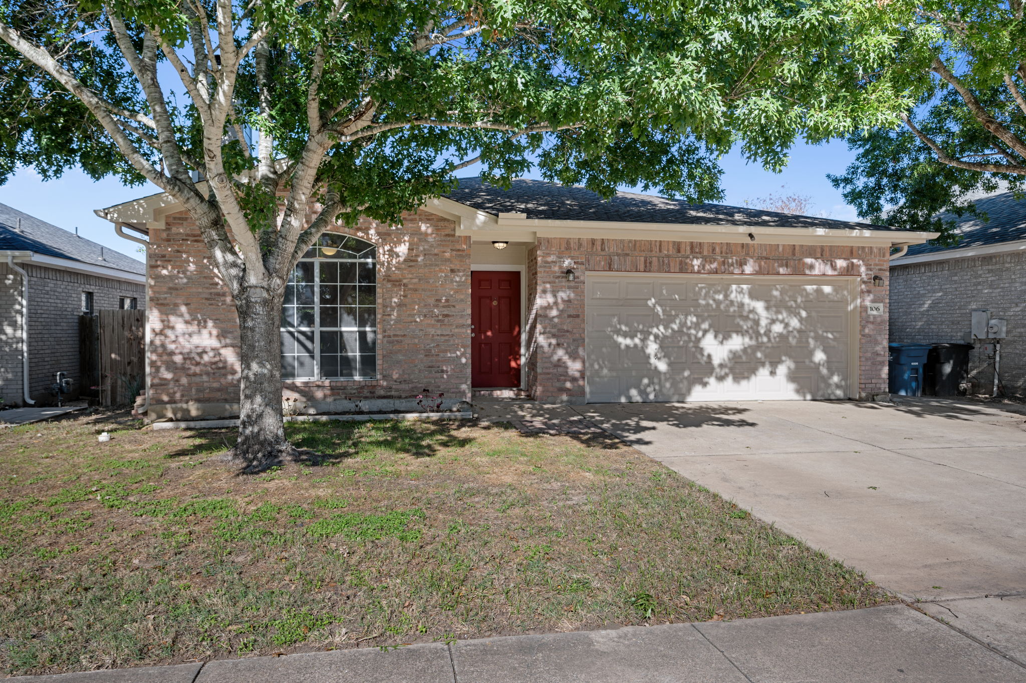 106 Shenandoah Trail Elgin, TX 78621 - Photo 2 of 26 front view of a house with a tree