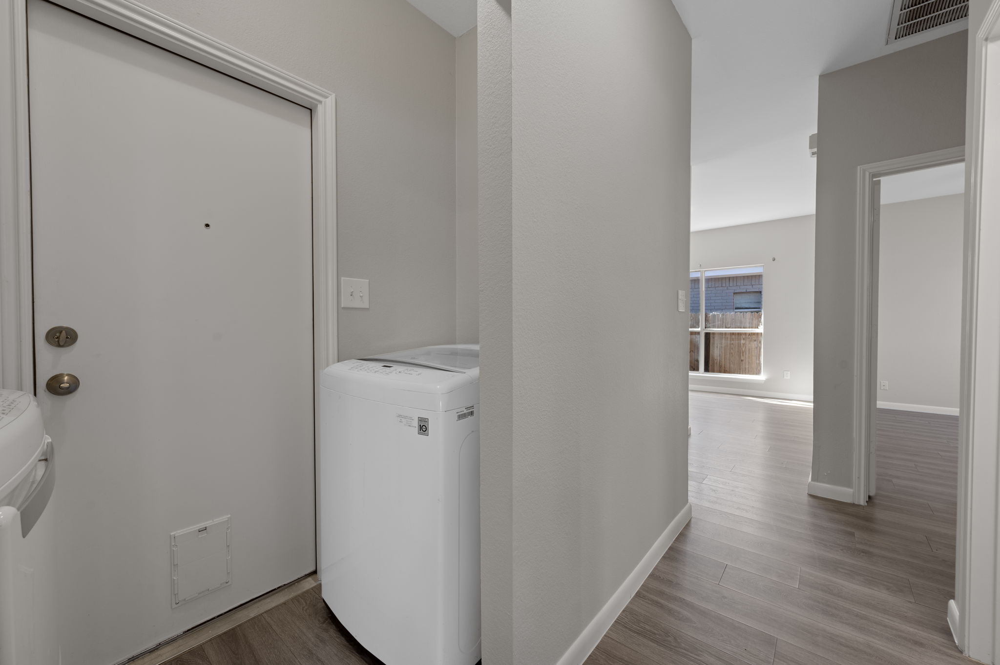 106 Shenandoah Trail Elgin, TX 78621 - Photo 21 of 26 a view of a hallway with wooden floor