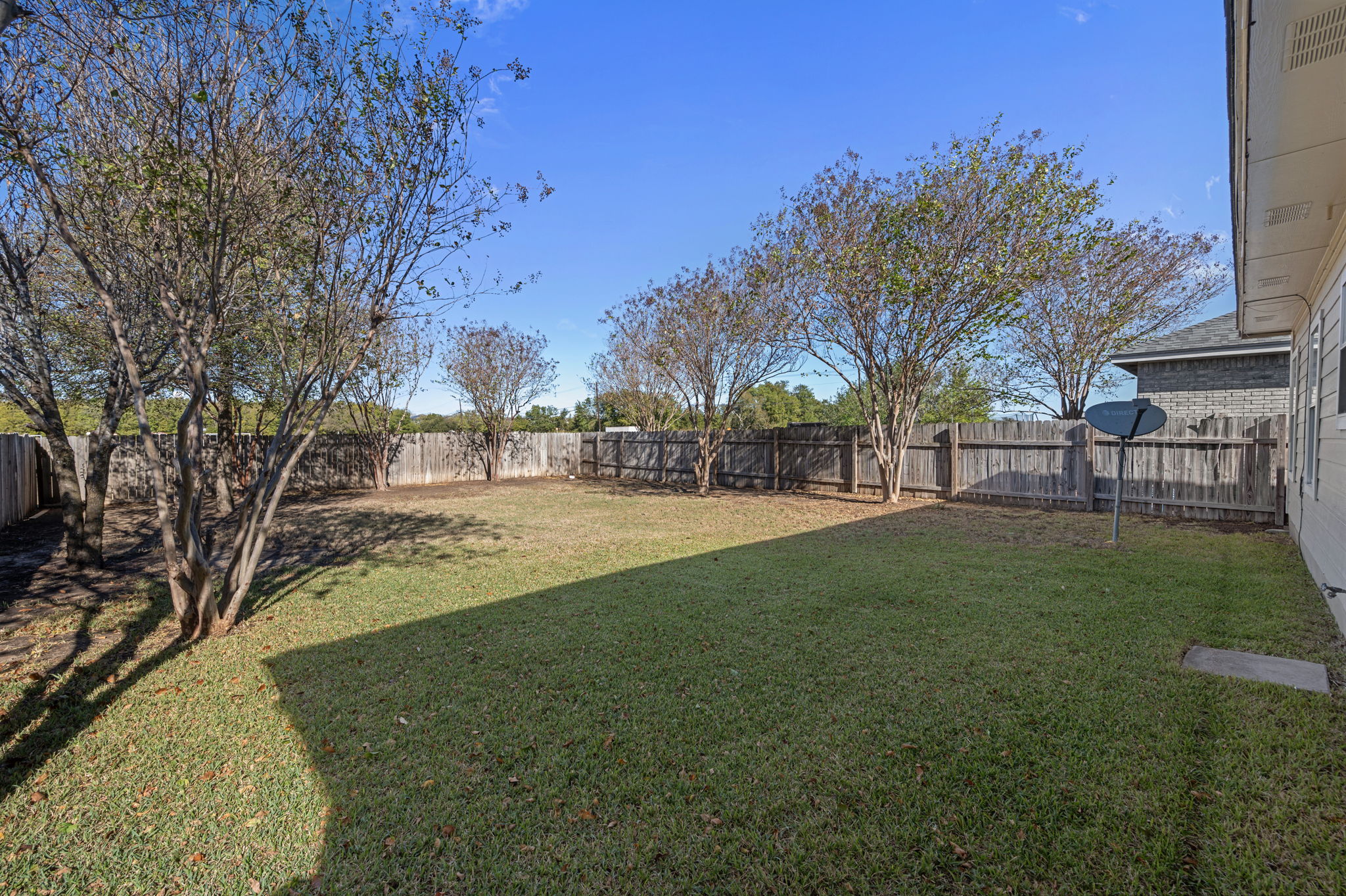 106 Shenandoah Trail Elgin, TX 78621 - Photo 23 of 26 a view of outdoor space with garden and trees