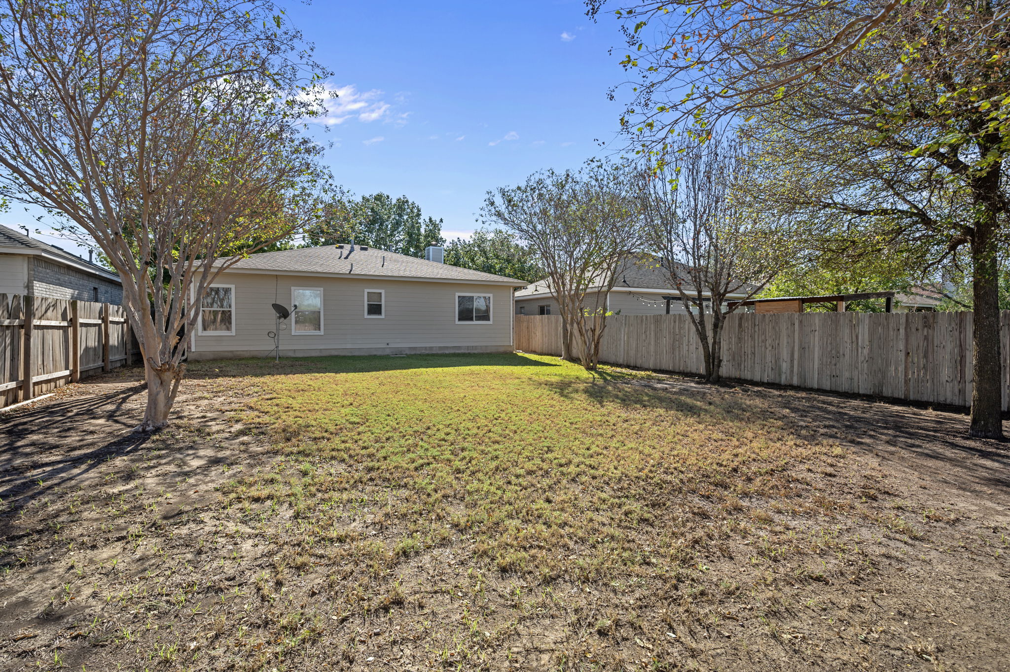 106 Shenandoah Trail Elgin, TX 78621 - Photo 25 of 26 a backyard of a house