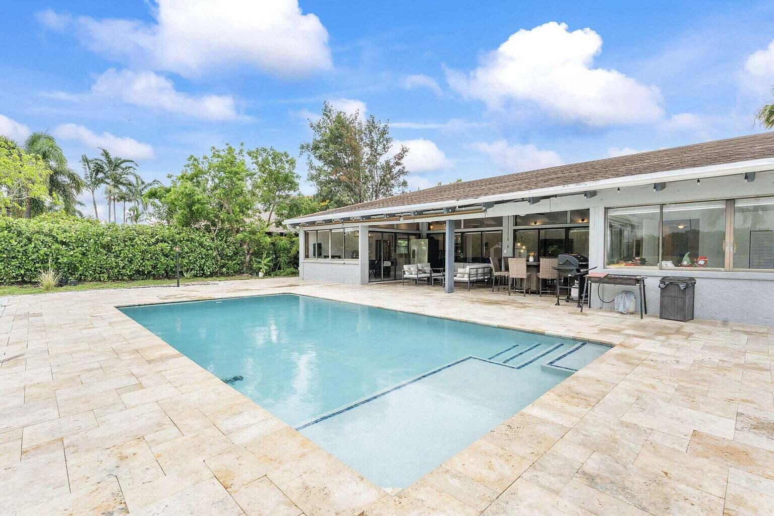 6031 Northwest 4th Avenue Boca Raton, FL 33487 - Photo 32 of 36 a view of house with swimming pool and sitting area