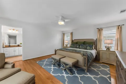 a bedroom with a bed and a view of kitchen