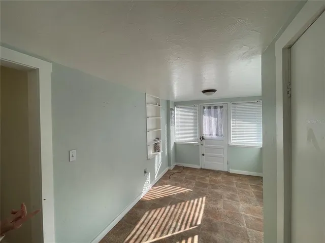 a bathroom with a bathtub sink and mirror