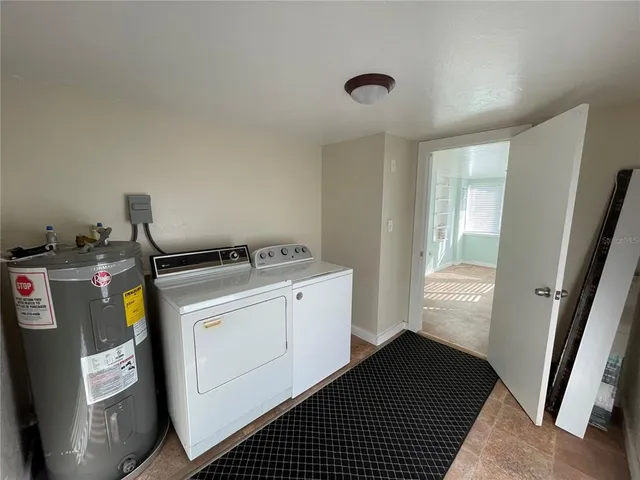 a view of a storage & utility room with a window