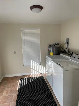 a kitchen with a sink and a refrigerator