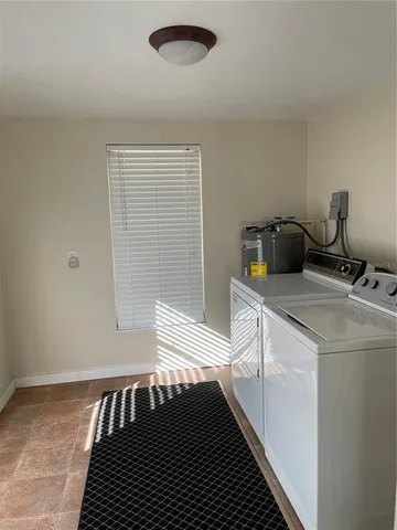 a kitchen with a sink and a refrigerator