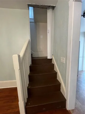 a view of entryway with wooden floor