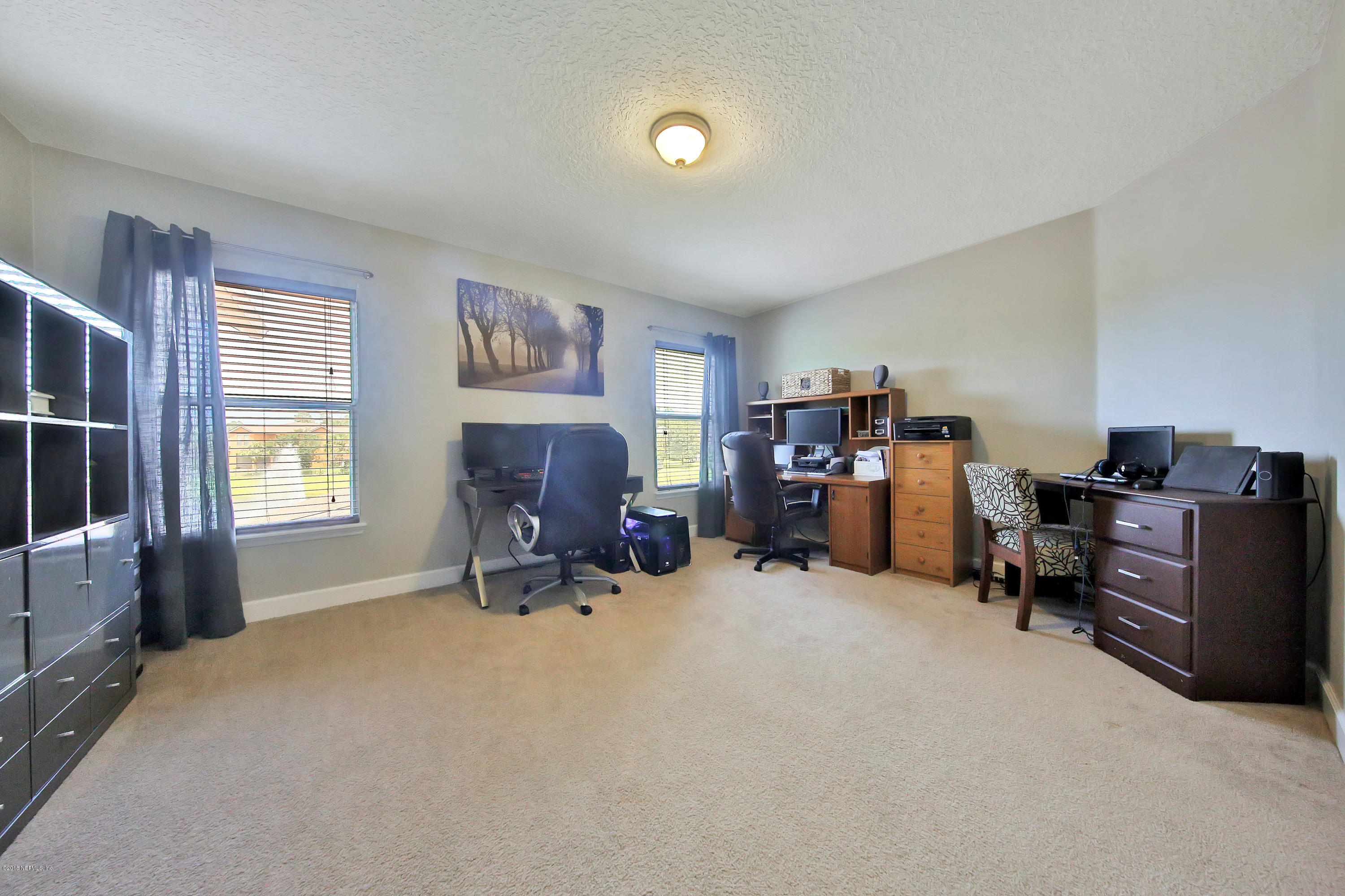 214 North Saxxon Road St. Augustine, FL 32092 - Photo 36 of 36 a view of a livingroom with workspace and a window