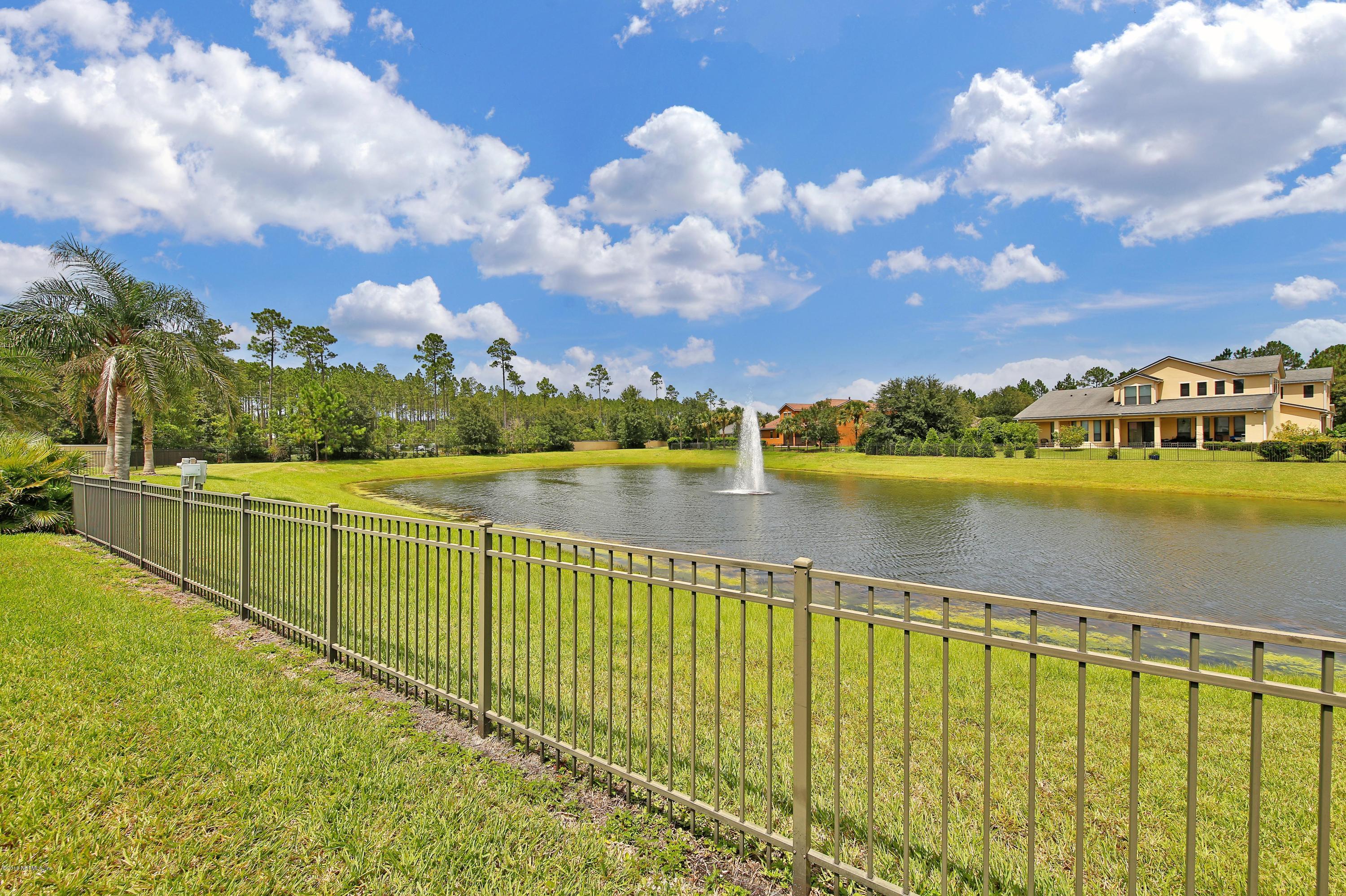 214 North Saxxon Road St. Augustine, FL 32092 - Photo 9 of 36 a view of a lake with a city