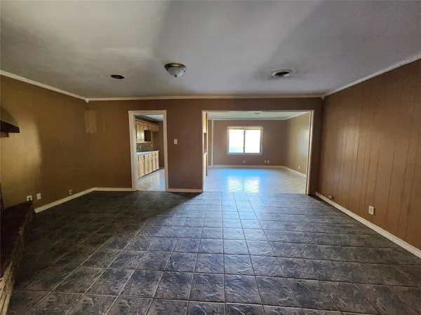 a view of an empty room and window