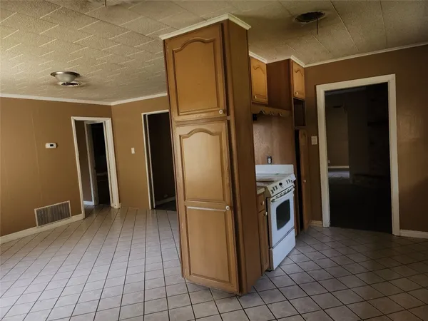 a kitchen with stainless steel appliances granite countertop a refrigerator and a stove