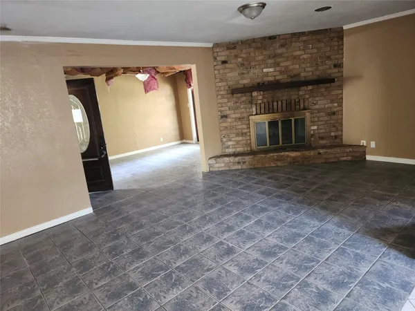a view of empty room with fireplace