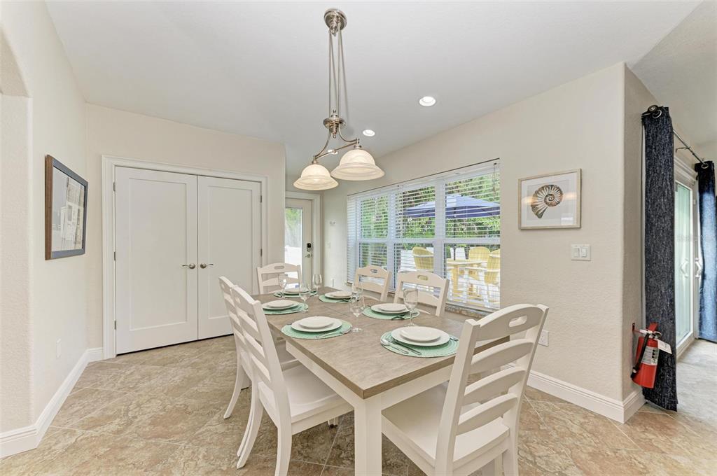 308 58th Street, Unit A Holmes Beach, FL 34217 - Photo 12 of 41 a view of a dining room with furniture