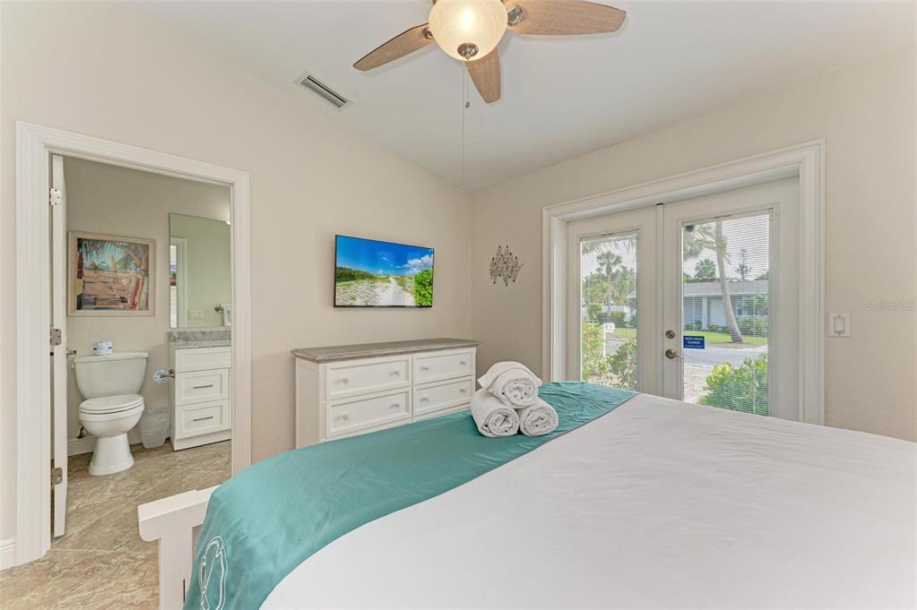 308 58th Street, Unit A Holmes Beach, FL 34217 - Photo 16 of 41 a bedroom with a bed and a window