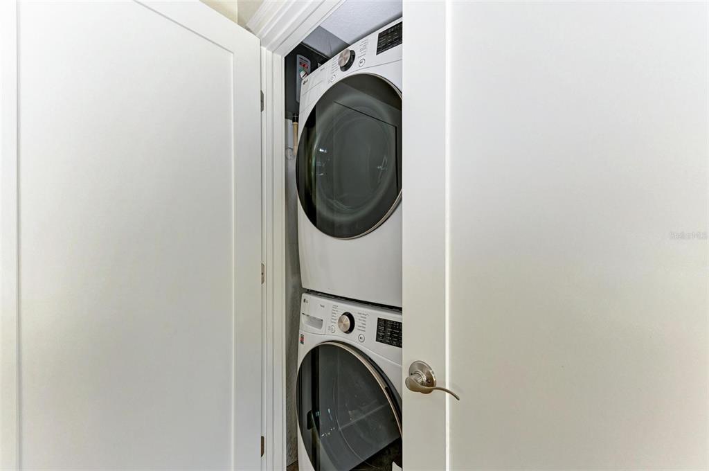 308 58th Street, Unit A Holmes Beach, FL 34217 - Photo 22 of 41 a utility room with dryer and washer