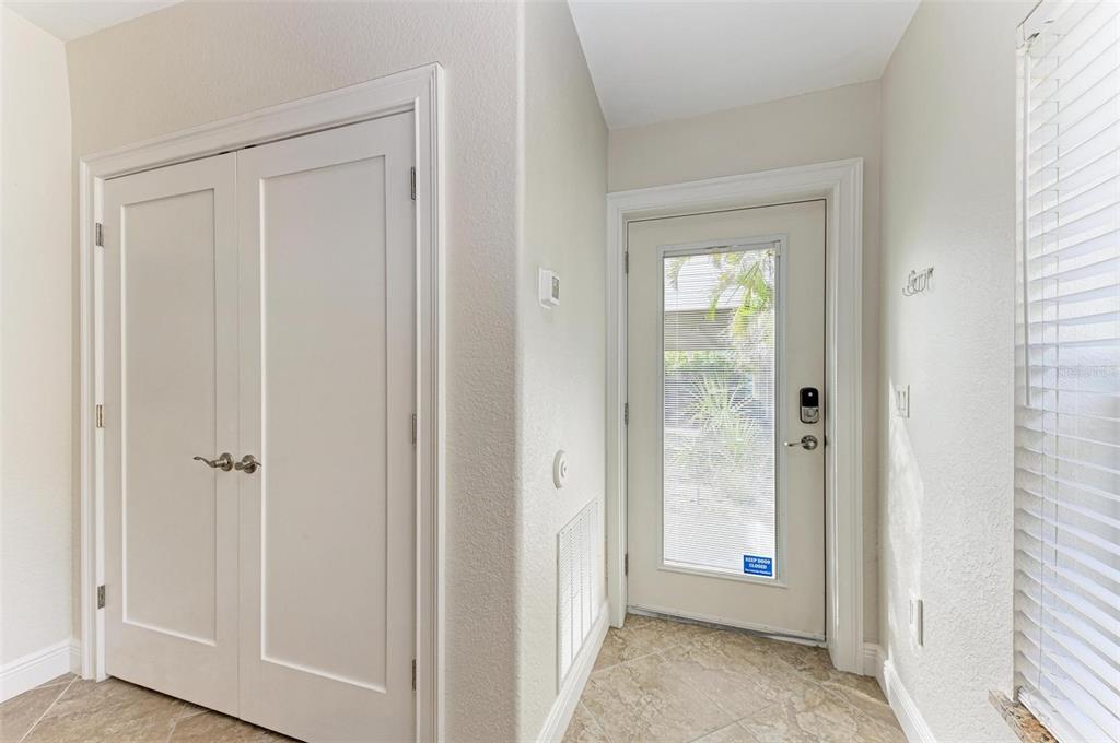 308 58th Street, Unit A Holmes Beach, FL 34217 - Photo 23 of 41 a view of a bathroom from the hallway