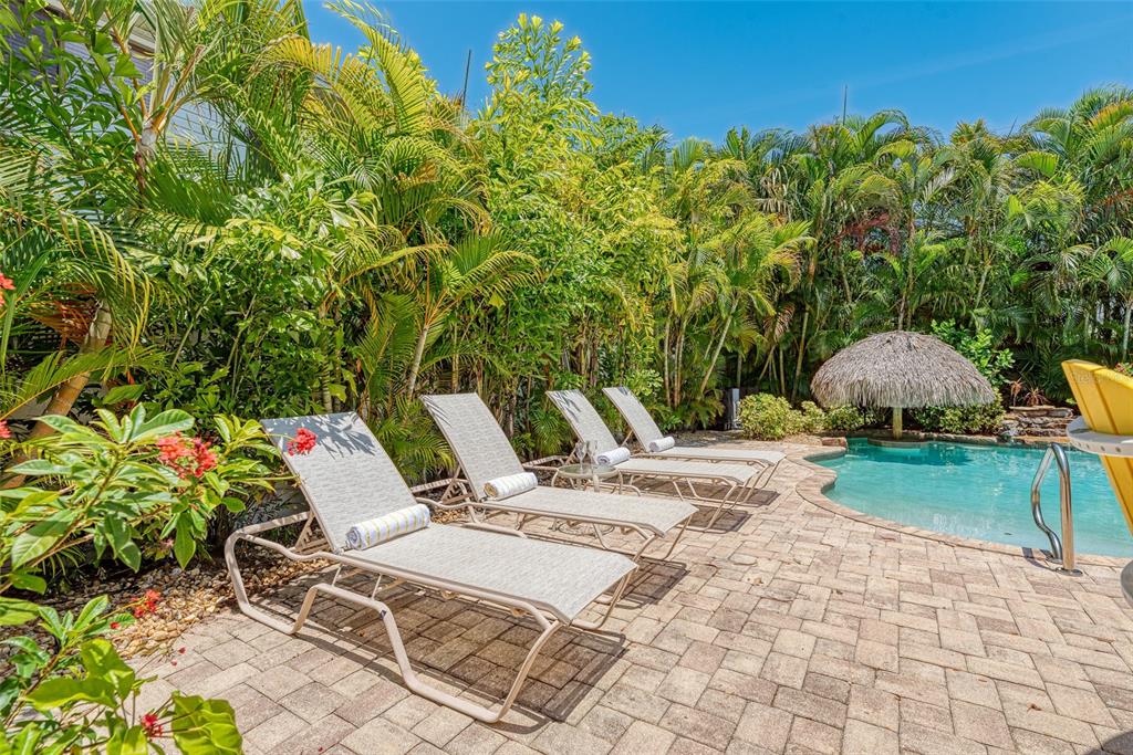 308 58th Street, Unit A Holmes Beach, FL 34217 - Photo 24 of 41 a view of an outdoor space and seating area