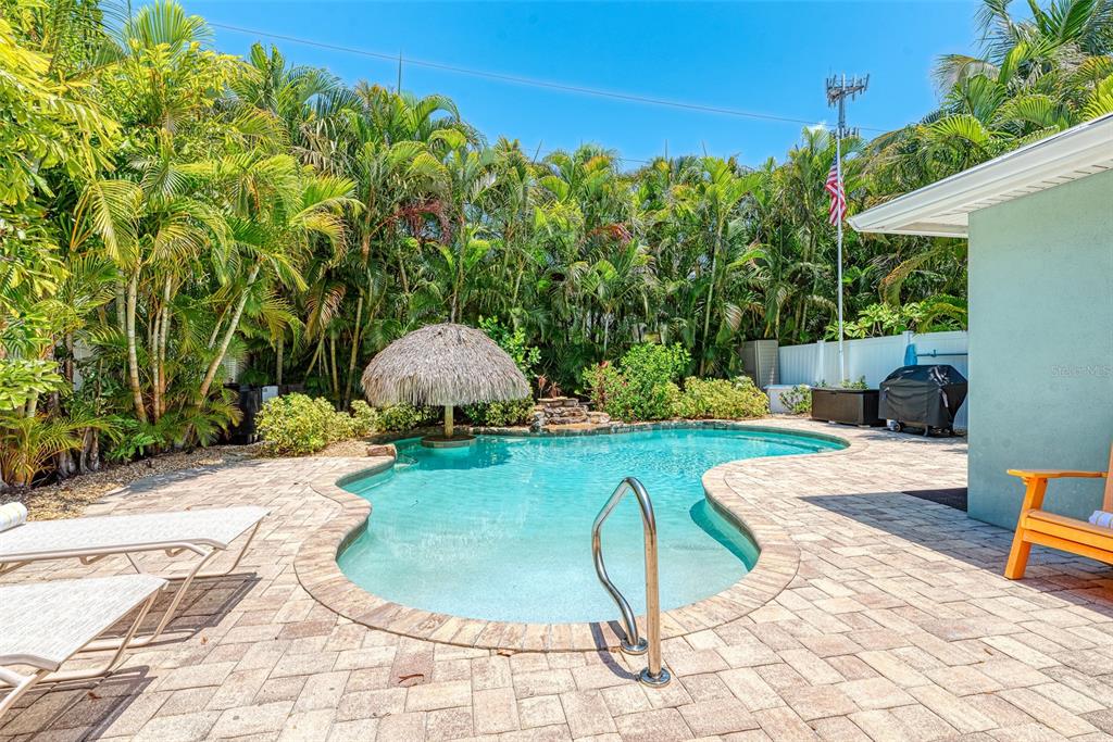 308 58th Street, Unit A Holmes Beach, FL 34217 - Photo 29 of 41 a view of a backyard with plants and outdoor seating